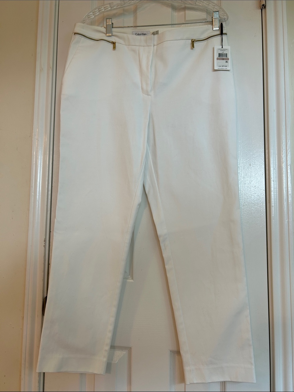 Calvin Klein White Straight Leg Jeans with Gold Zipper Accents